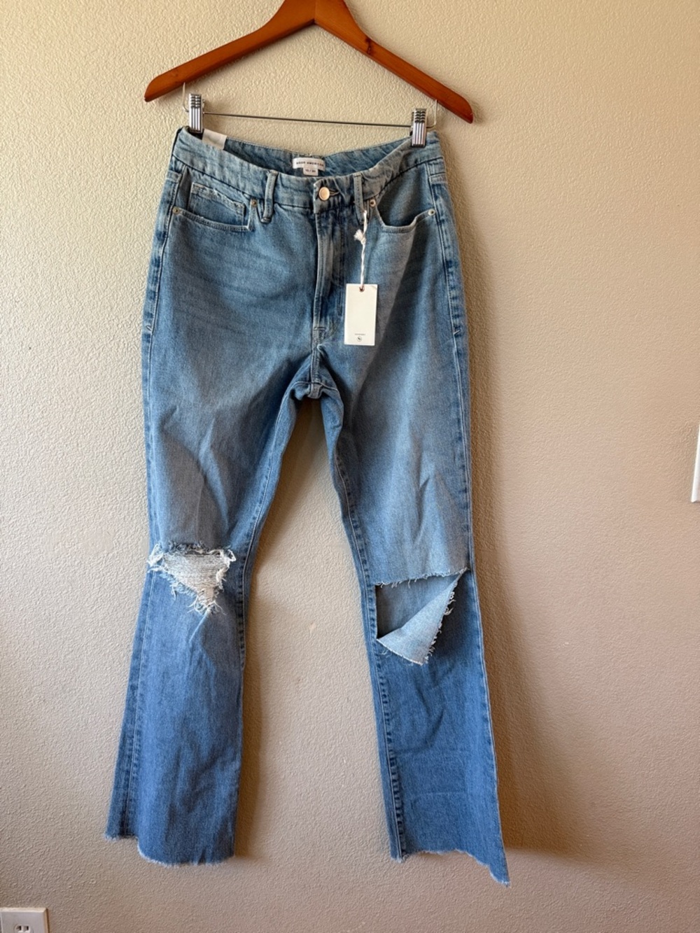 Good American Mid Wash Flare Jeans with Knee Rips